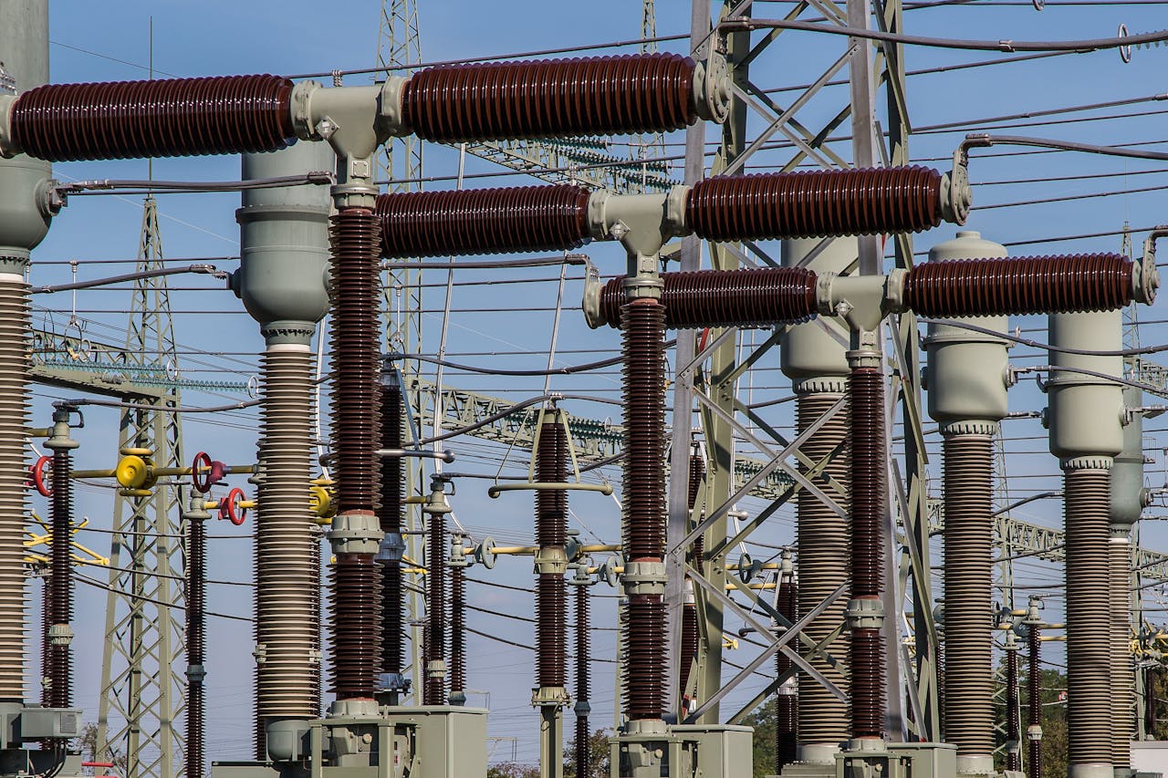 Mastering the First Impression: Your intriguing post title goes here Detailed view of high voltage electrical substation with transformers and power lines.